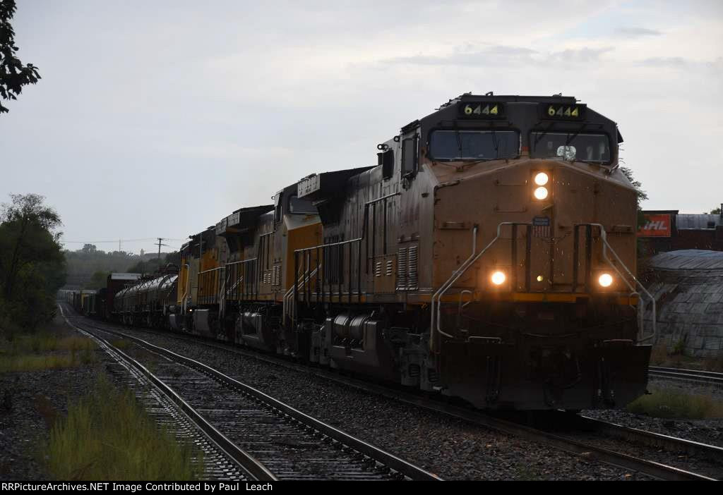 Manifest rolls north through the rain